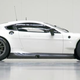 Illustration for article titled An Aston Martin With A Dinner Table Hanging Under Its Rear End Means Business